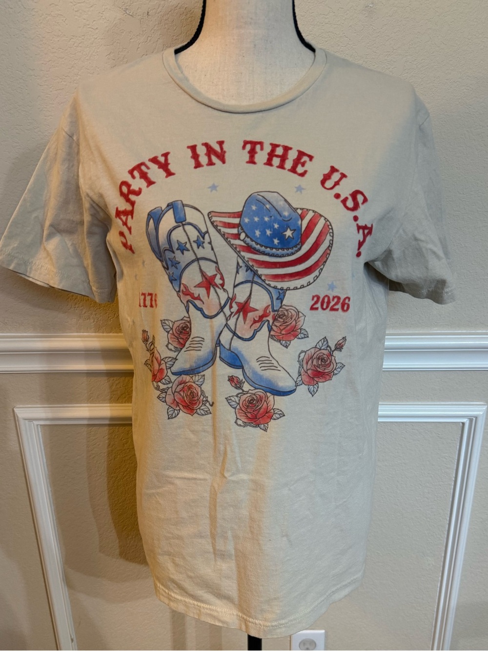 Goodie Two Sleeves T-Shirt Cream, Red/Blue Cowboy Boots 1776-2026 250th (M)